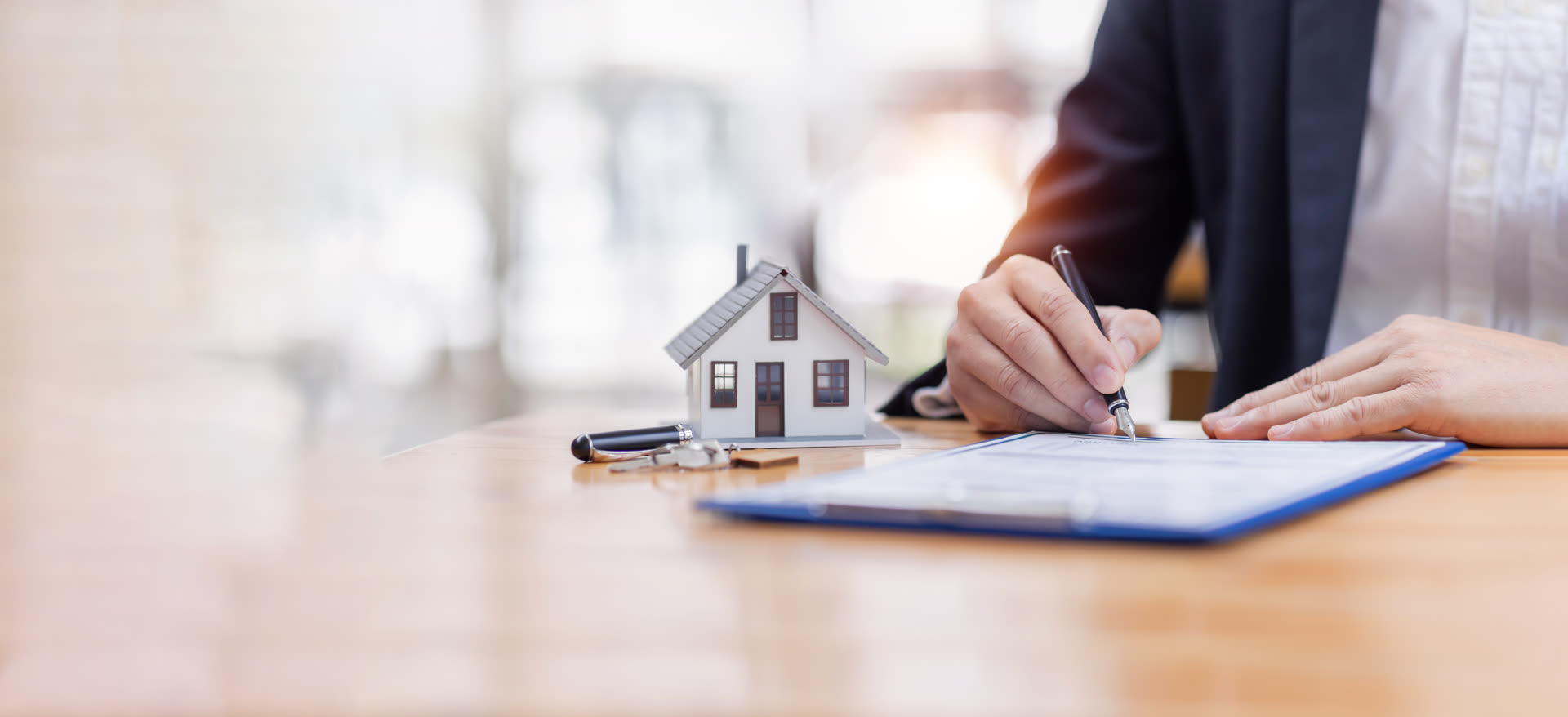 Signing rental application paperwork